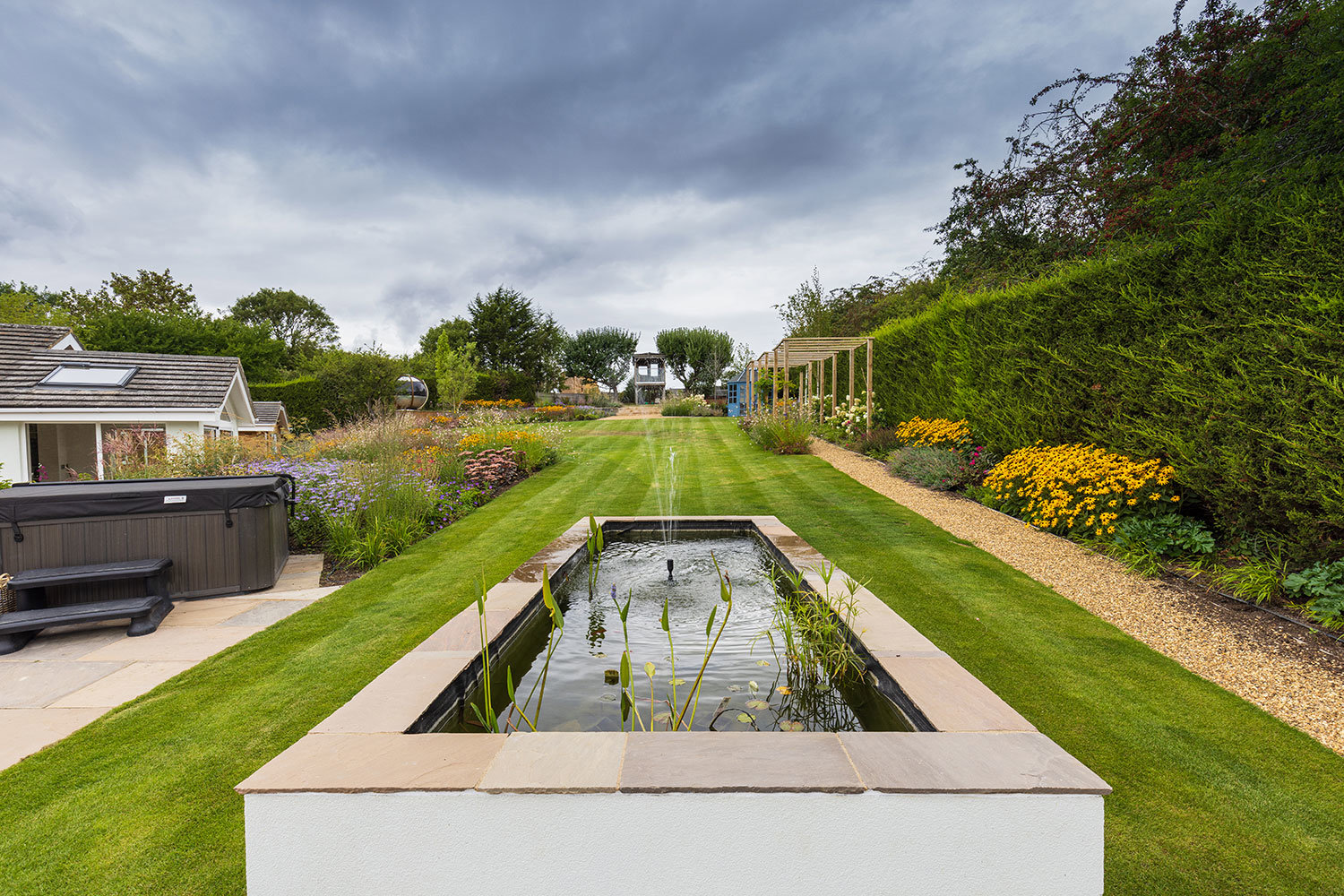 Raised fishpond with fountain
