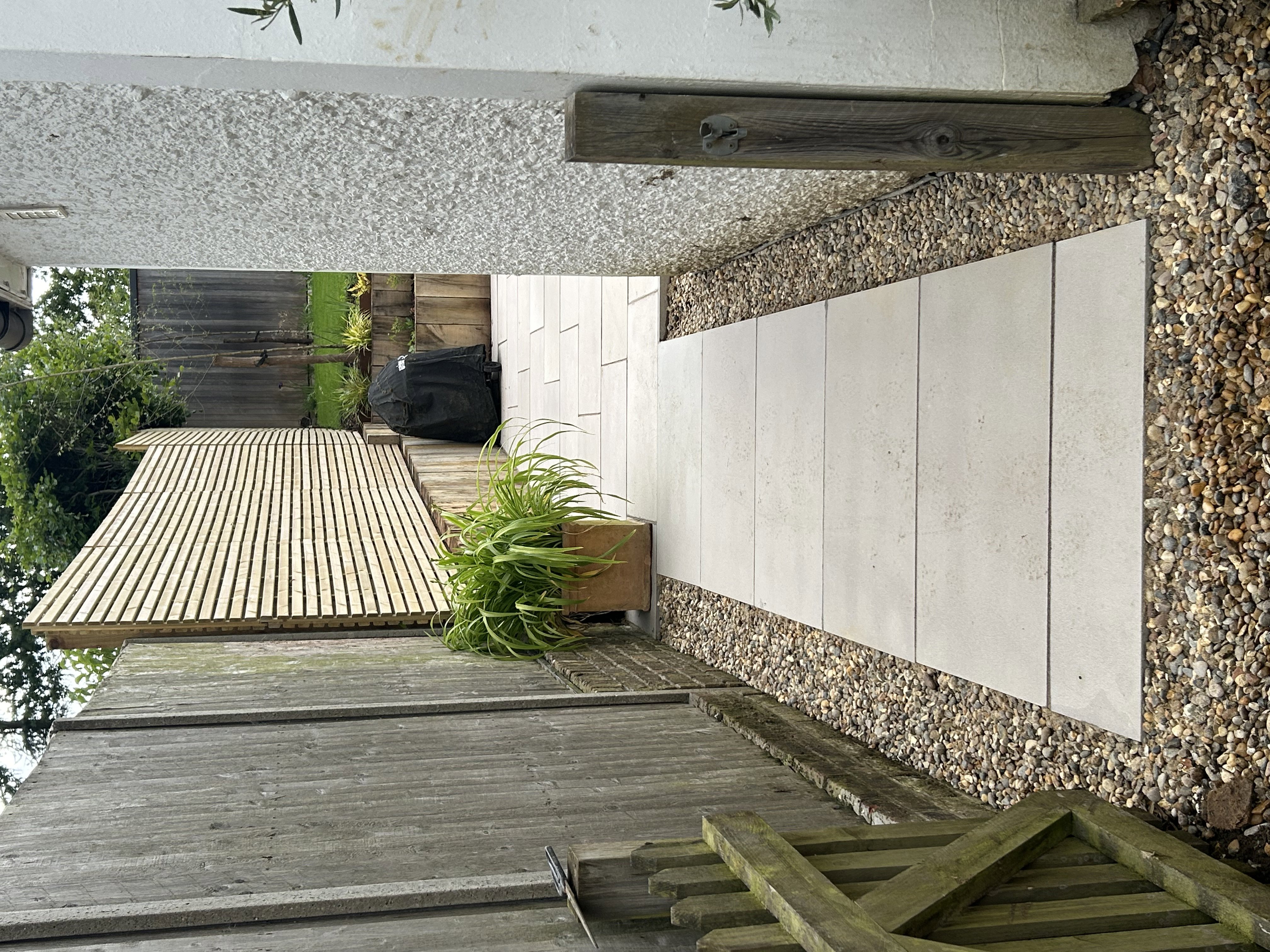 Contemporary slat fence and path  