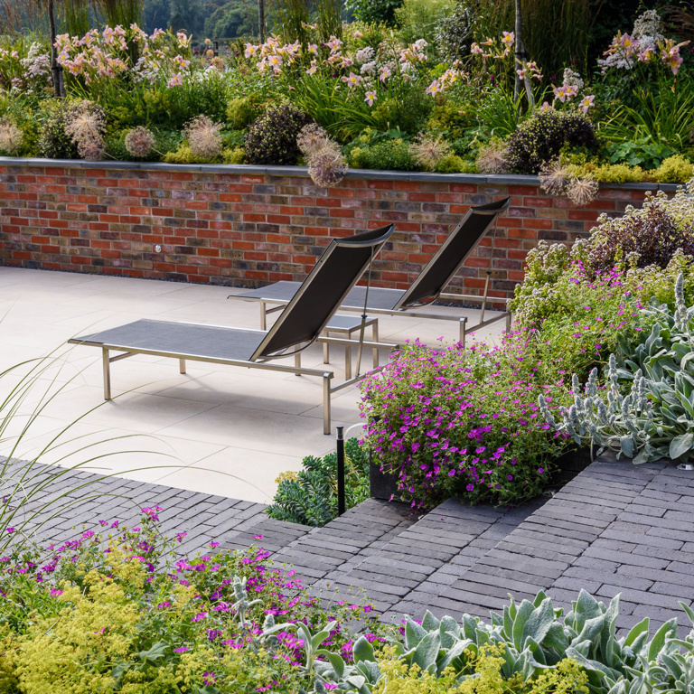 Sunken terrace with clay paver steps and detail and porcelain paving