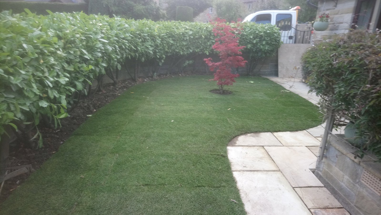 Stone path and new lawn at front of house