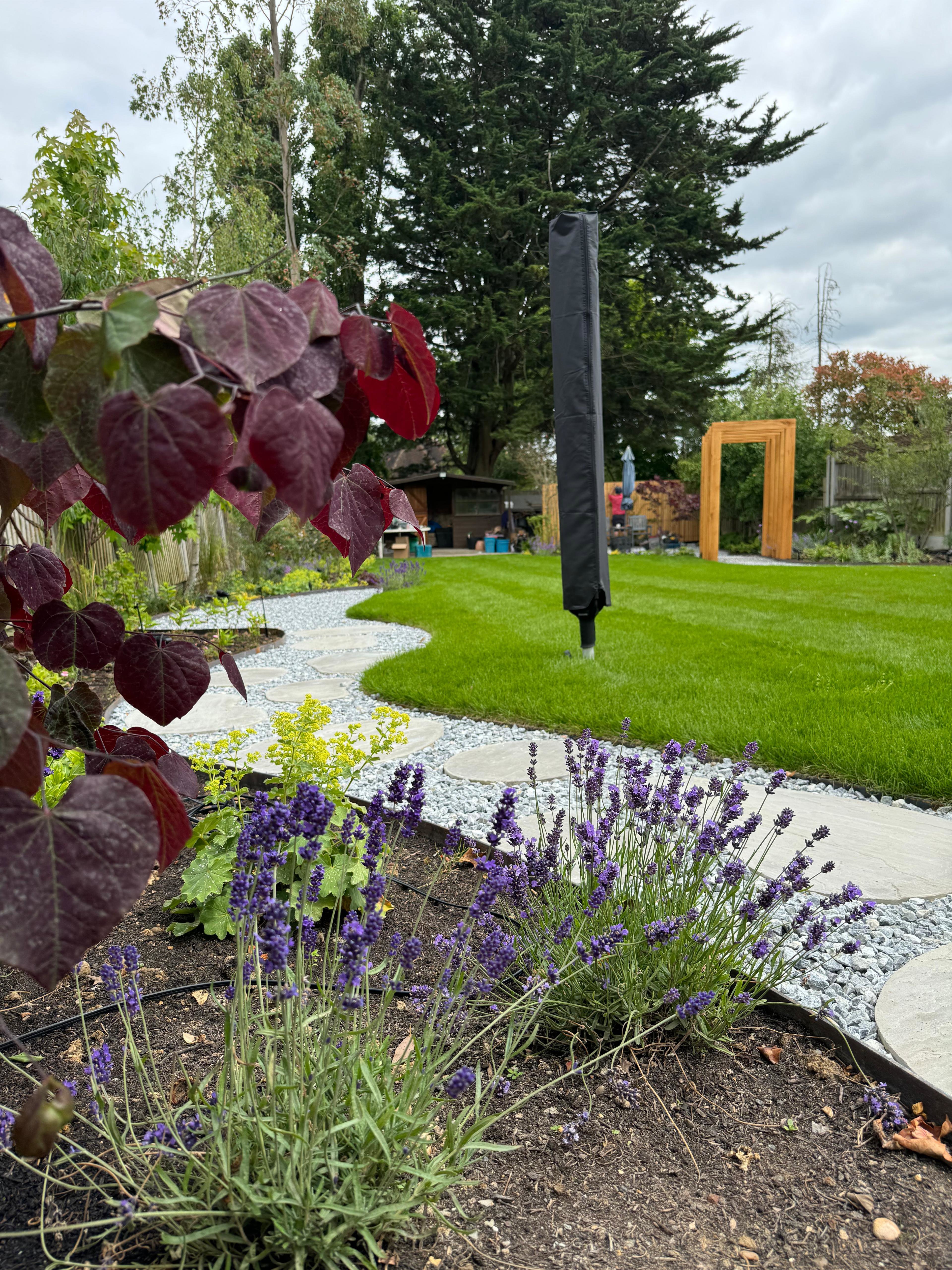 Flower bed and bespoke stepping stone pathway